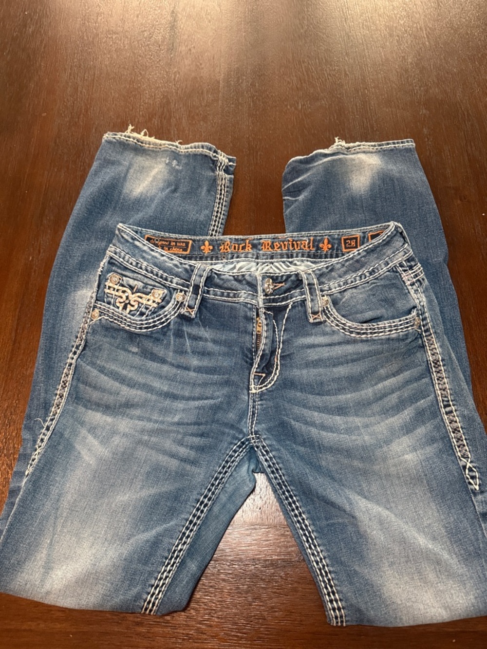 Size 28: Rock Revival Women’s Blue Boot Cut Jeans with PINK Contrast Stitching